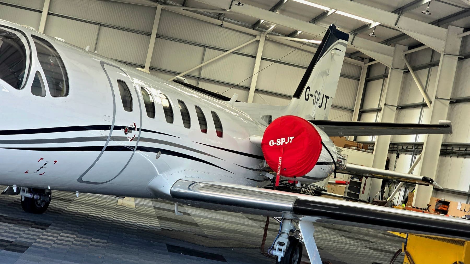 Rear-quarter view of a charter Citation after a routine clean, engine covers fitted